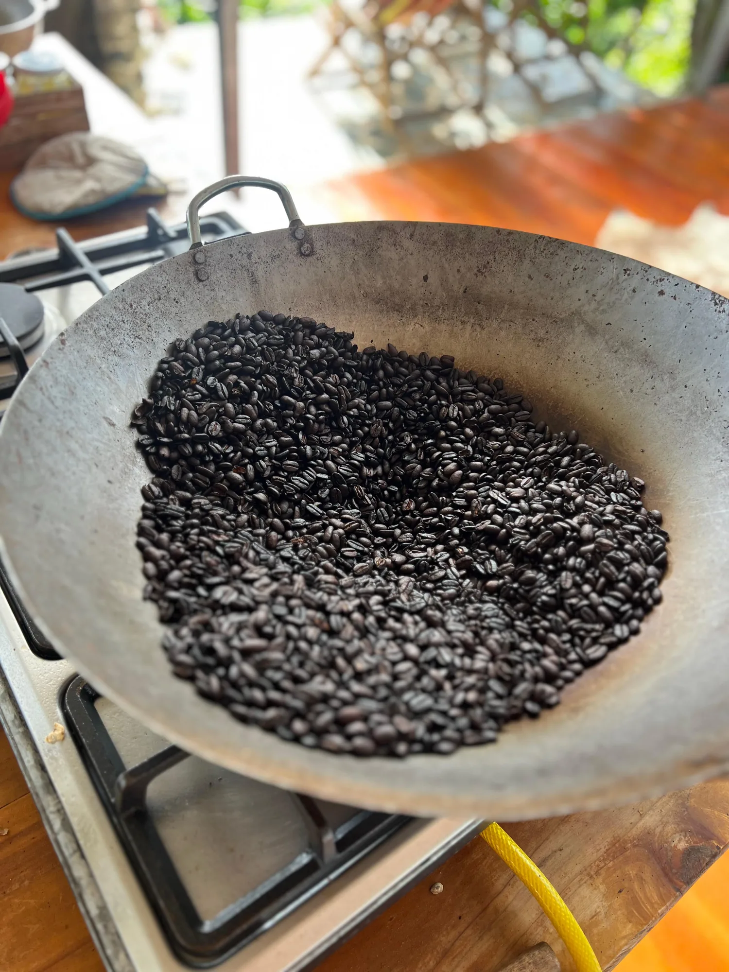 Coffee roasting in a wok on the stove